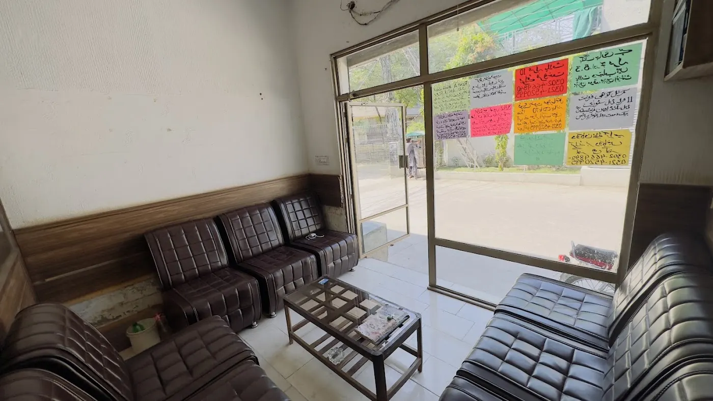 Inside Faisal Estate Agency: brown sofas by the window