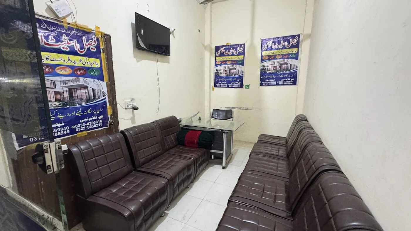Sofas facing the glass front, Multan Road outside